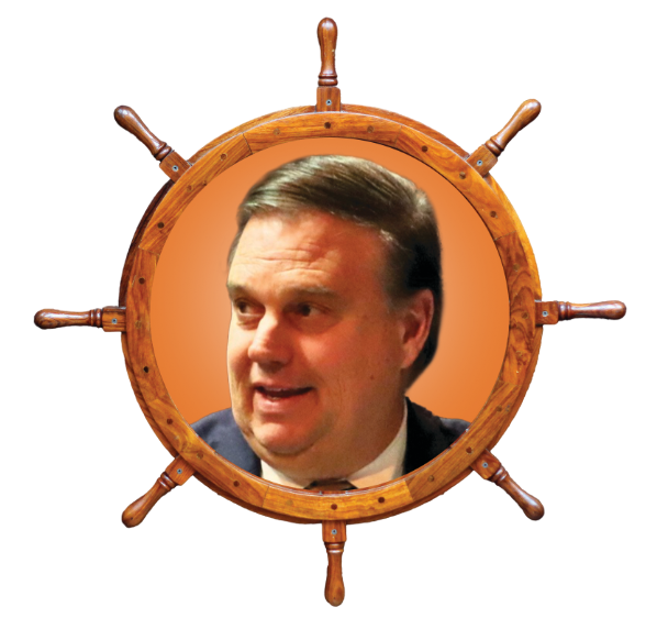 Picture of Delegate Chad Green set inside an old-timey, wooden boat steering wheel